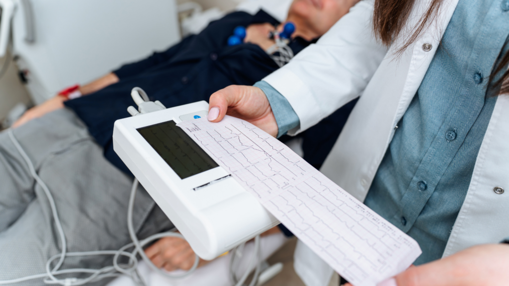 Doctor looks at patients ECG results